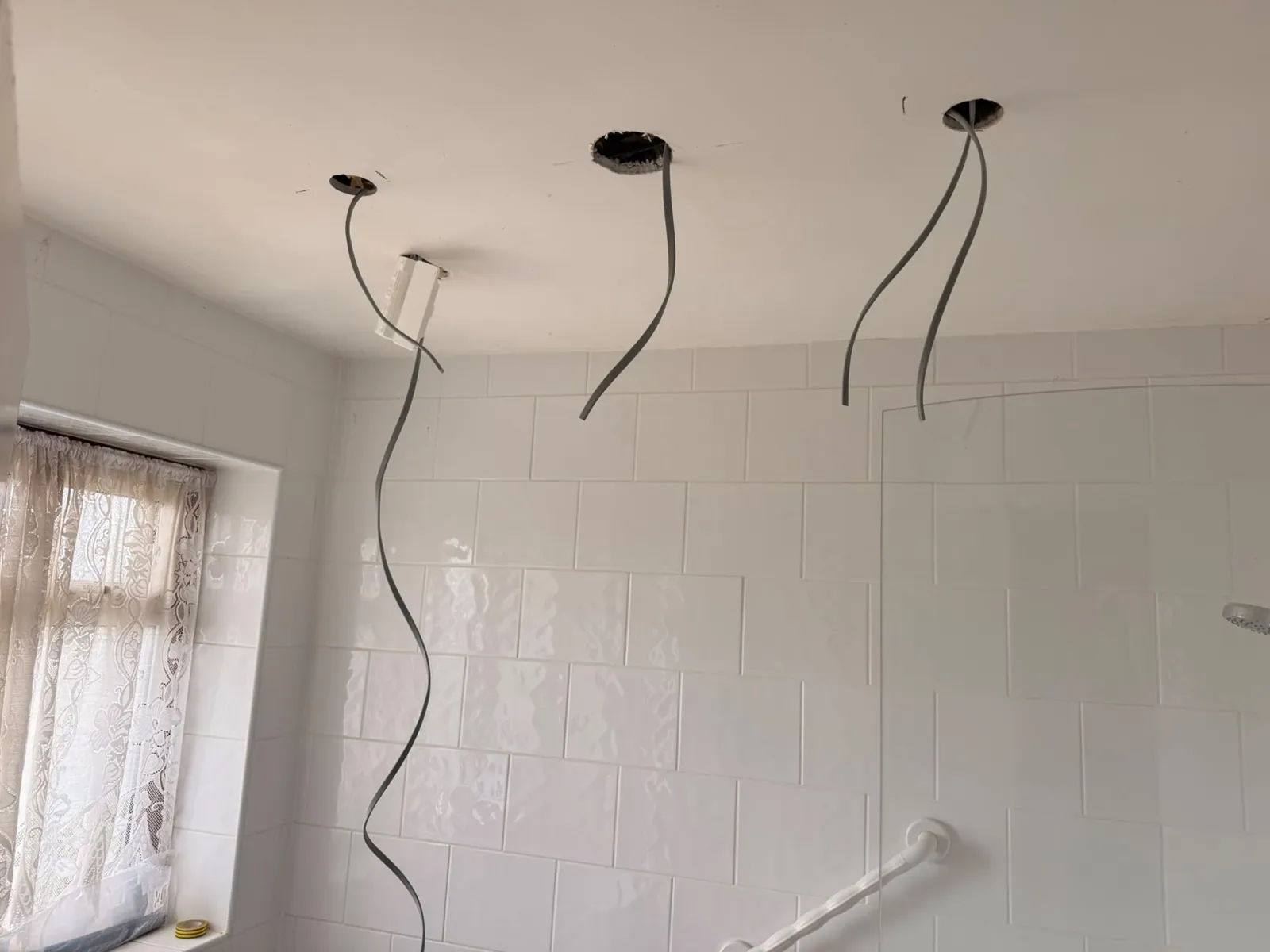 Bathroom ceiling cut-outs prepared for new downlights