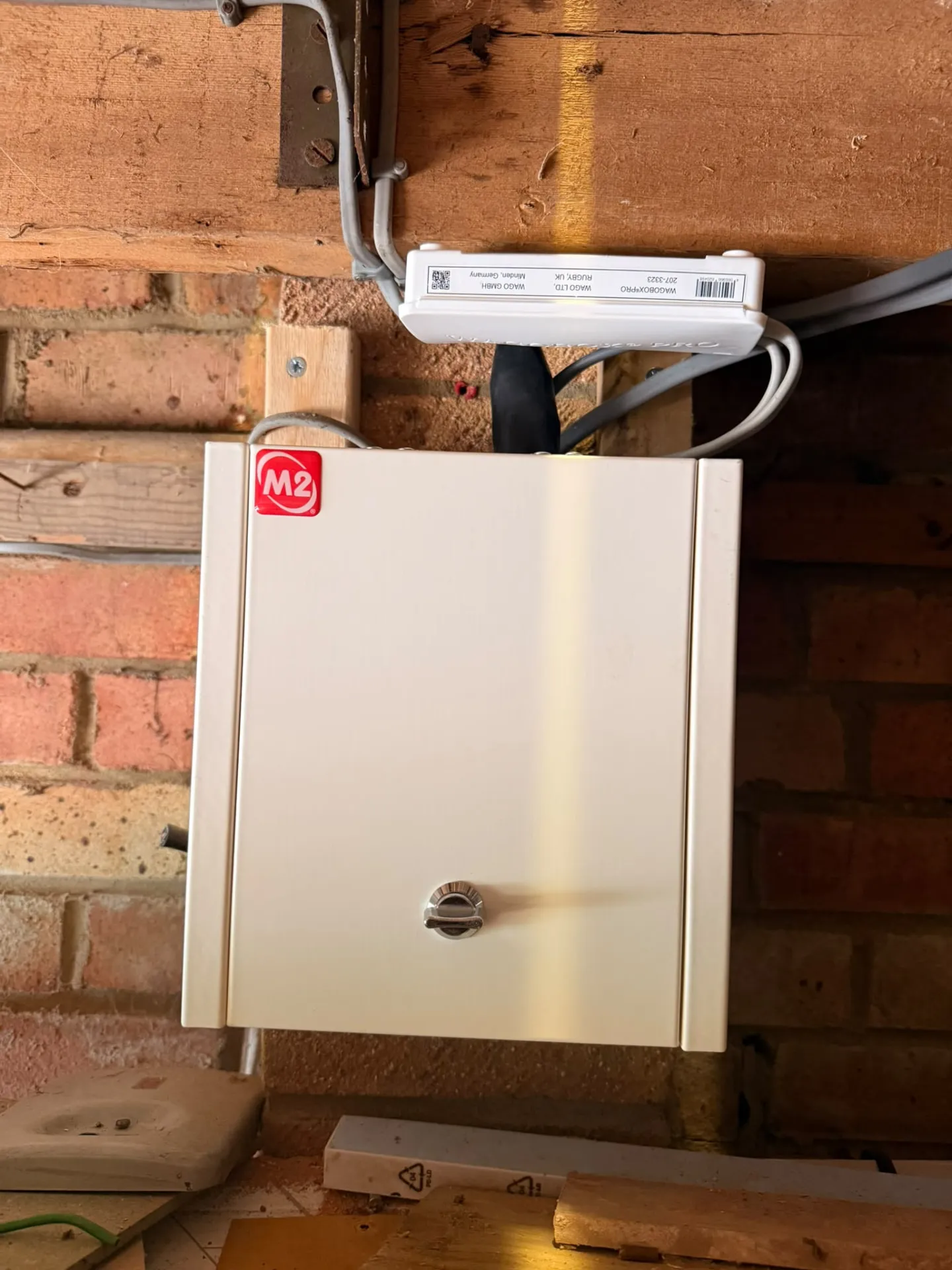 Metal sub-board and junction box installed in a garage