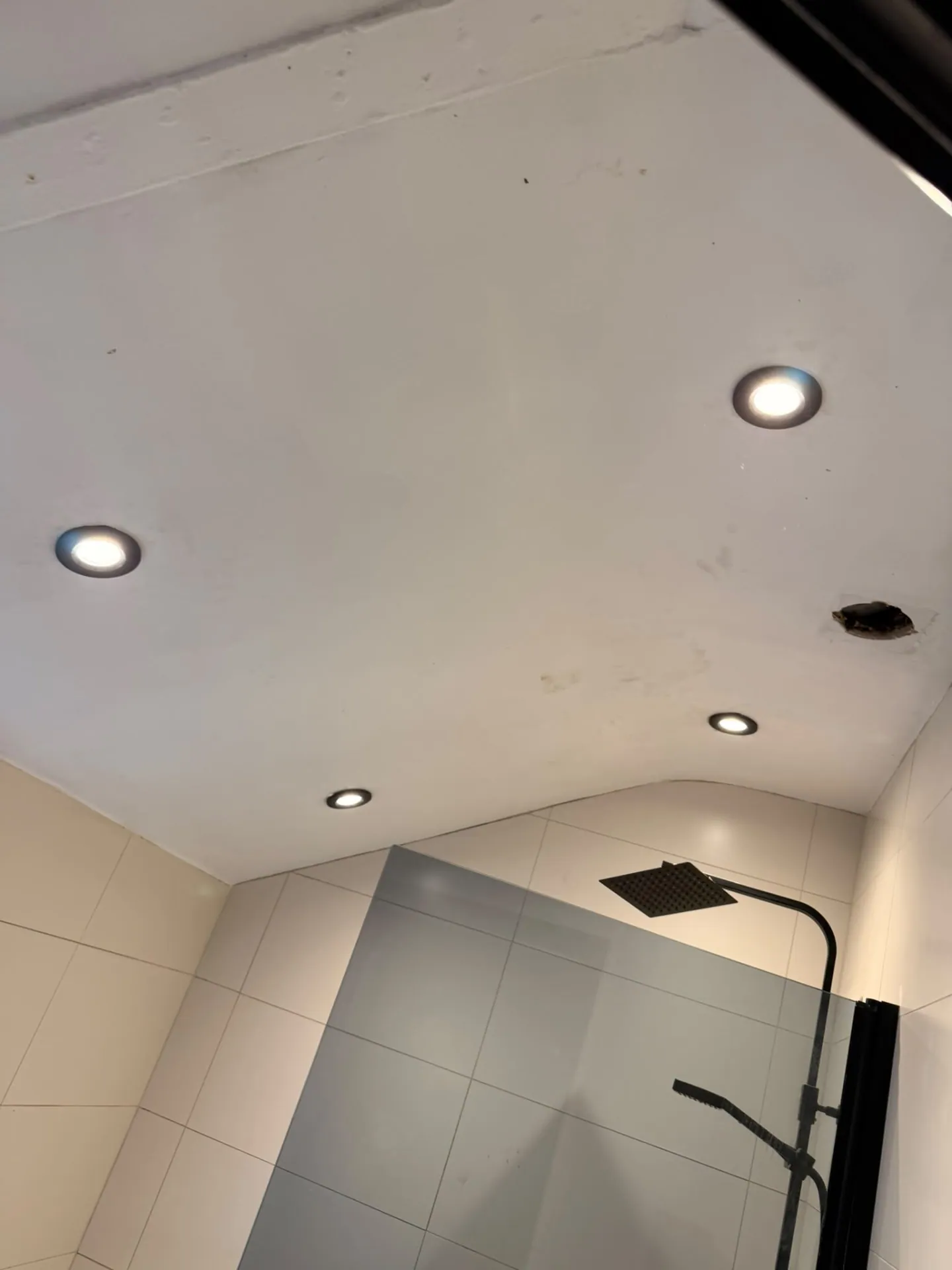 Bathroom LED downlights installed in a tiled ceiling