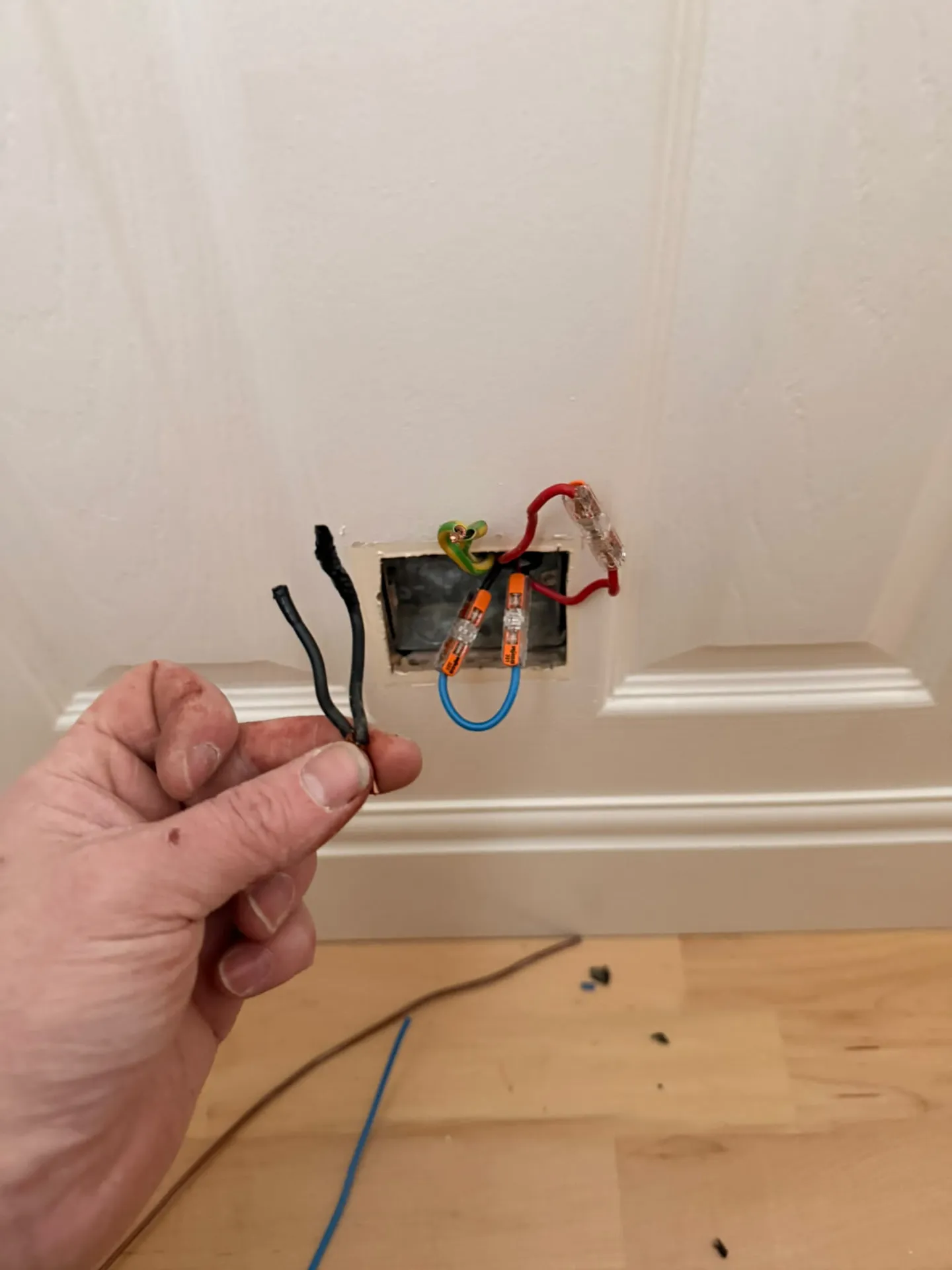 Exposed wiring at a switch box during a fault investigation