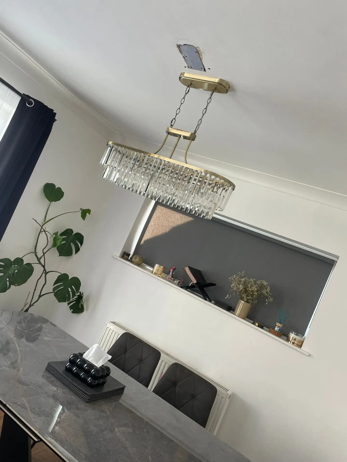 Feature chandelier fitted above a dining table