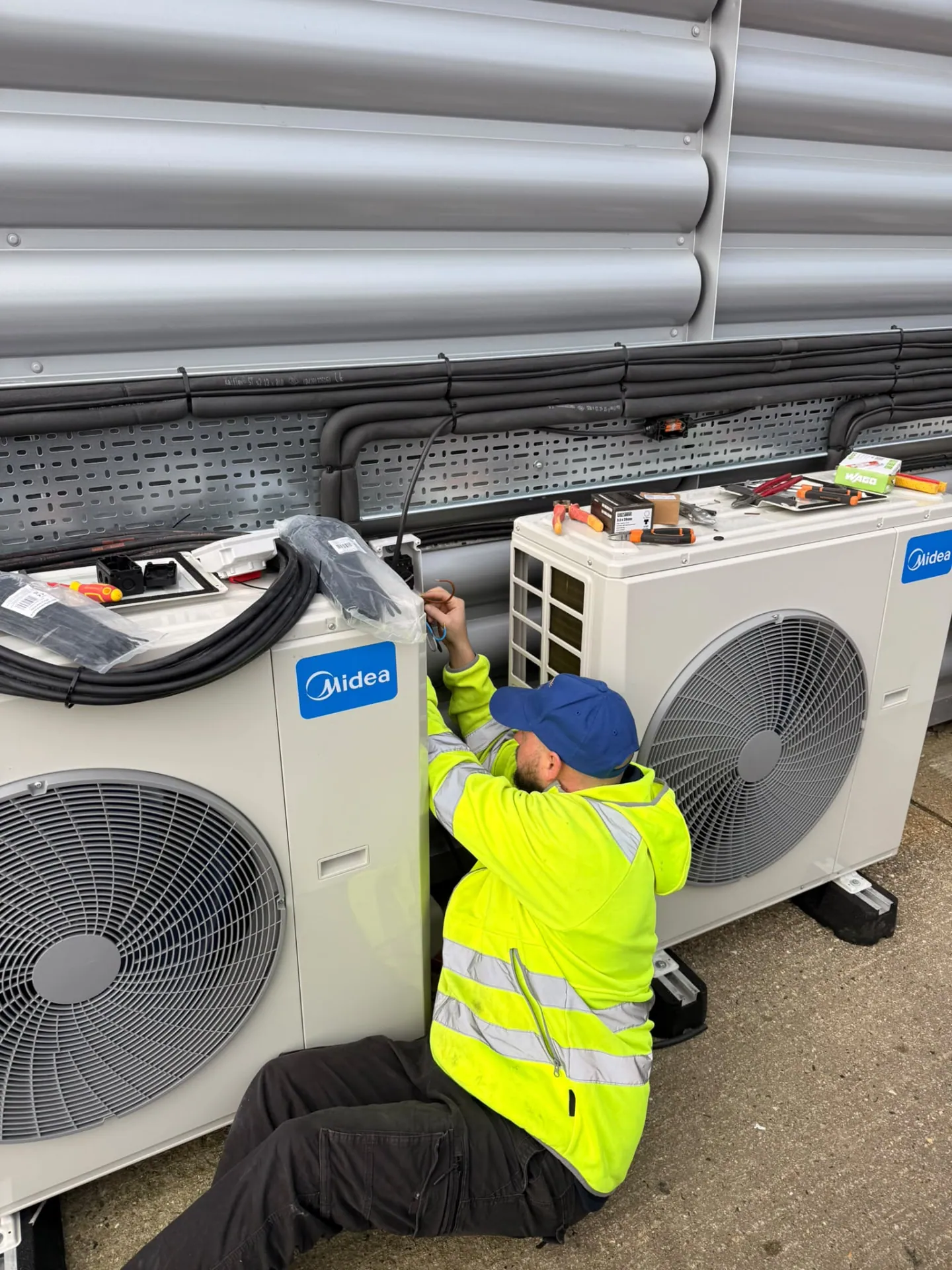 Electrician wiring commercial air conditioning units