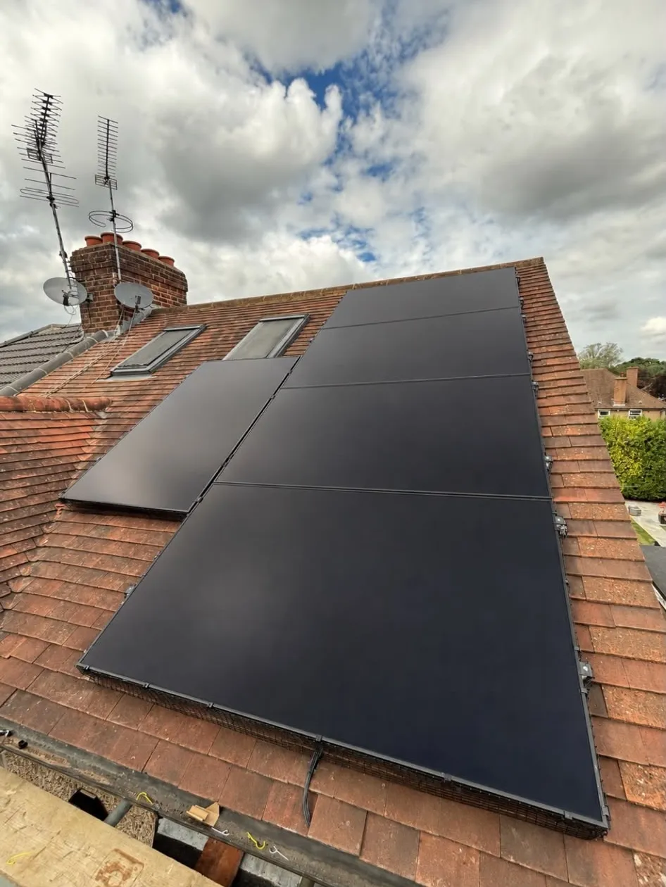 Solar panels installed on a tiled house roof
